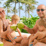 Families relaxing on Bai Dai Beach with calm waters near family resorts in Cam Ranh.