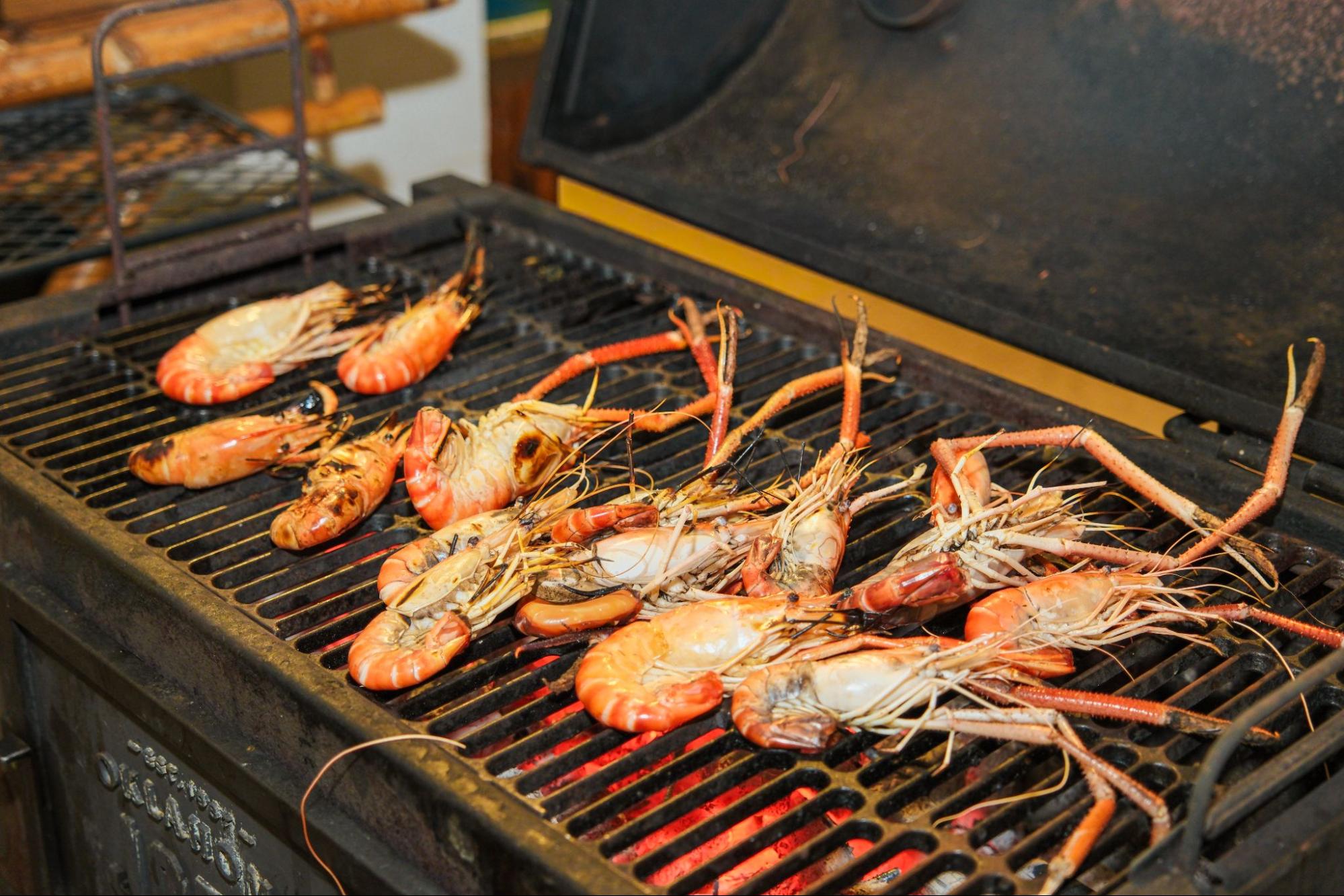 Fresh grilled lobster served at a seaside restaurant, highlighting local seafood specialties for what to eat in Cam Ranh.