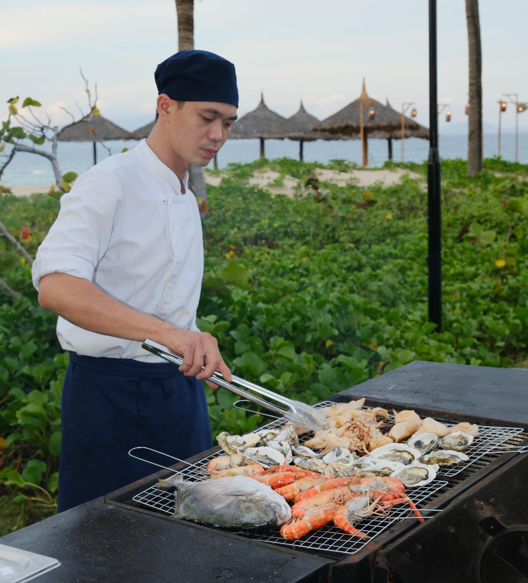 Fresh grilled lobster served at a seaside restaurant, highlighting local seafood specialties for what to eat in Cam Ranh.