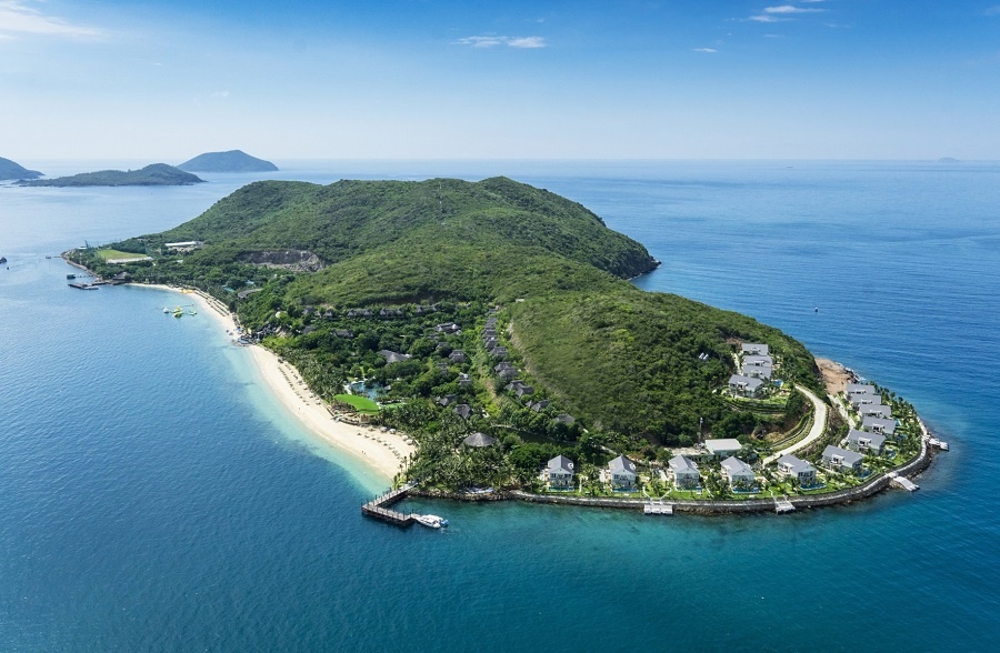 Tourists enjoying water sports and relaxing on the beach as part of top things to do in Nha Trang.